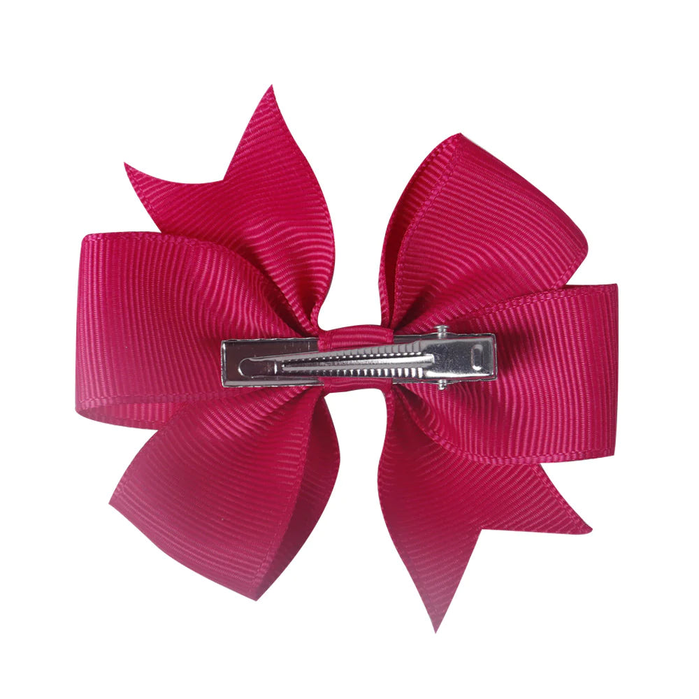 Colorful 3-inch boutique pinwheel hairbow by ModestAndDevoted with vibrant paper pinwheel design for children's hair accessories.