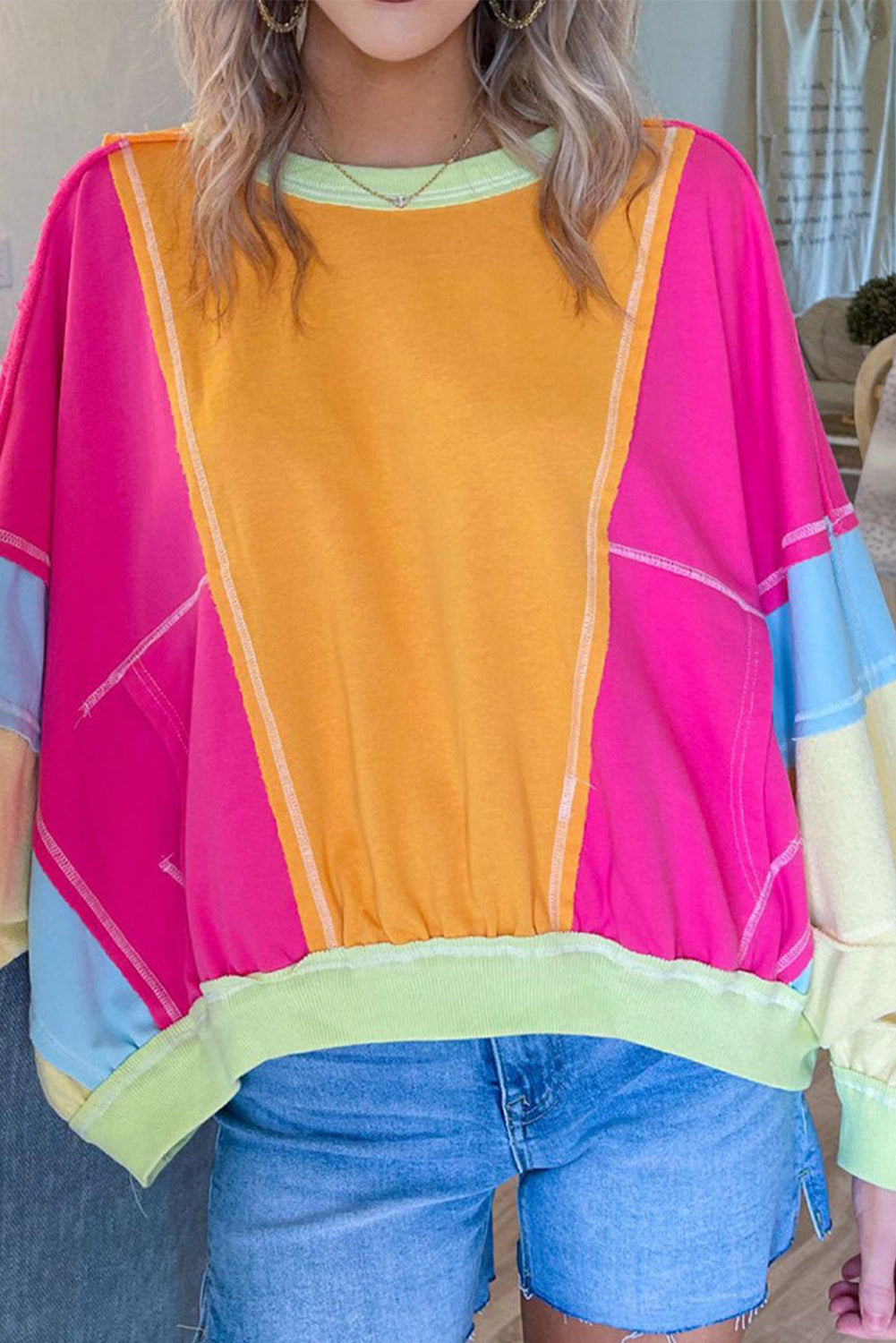 Rose red plus size colorblock patchwork sweatshirt with exposed seams, made of polyester and cotton, by ModestAndDevoted.
