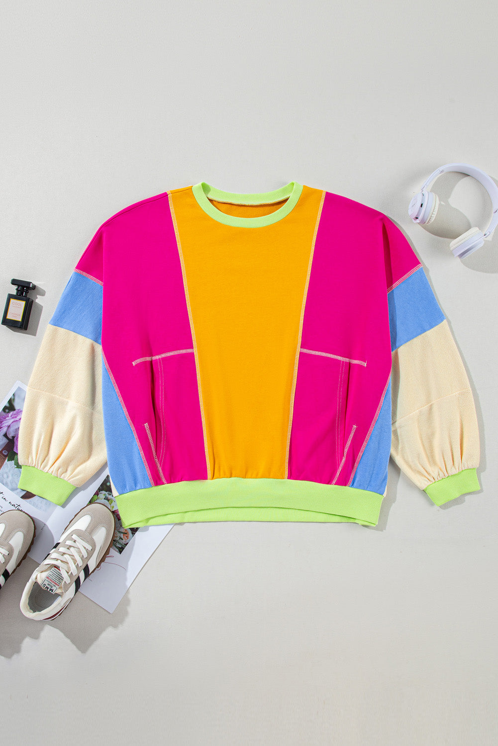 Rose red plus size colorblock patchwork sweatshirt with exposed seams from ModestAndDevoted, made of polyester and cotton fabric.