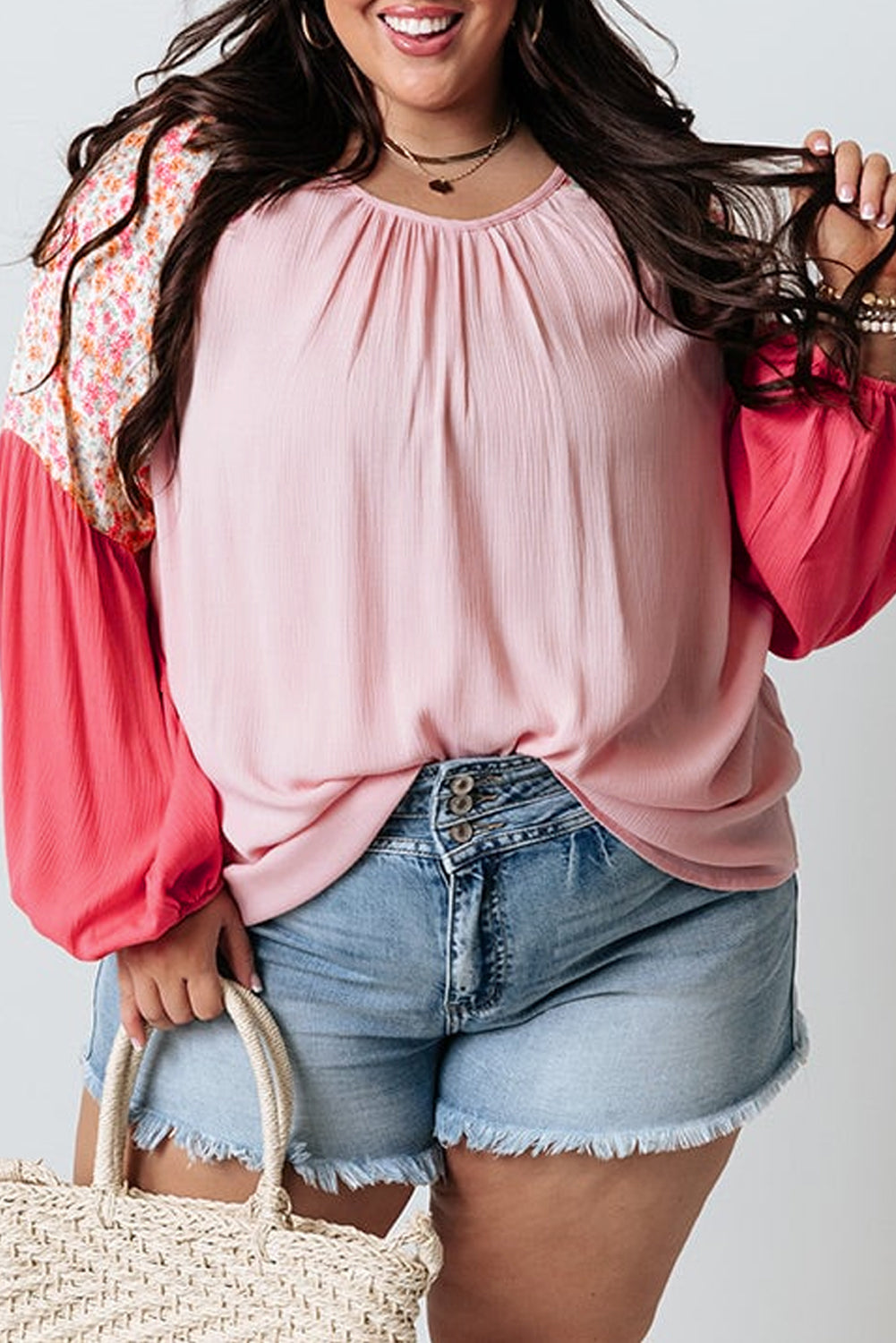 Pink floral patchwork long sleeve blouse for plus size women by ModestAndDevoted, featuring contrast floral details and polyester fabric.