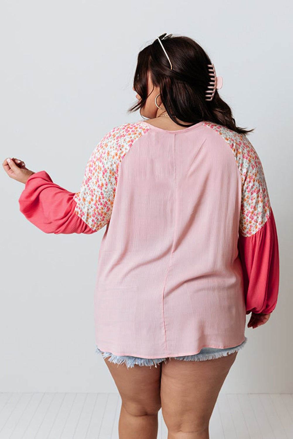 Pink floral patchwork long sleeve plus size blouse by ModestAndDevoted, featuring contrast floral design and comfortable fit.
