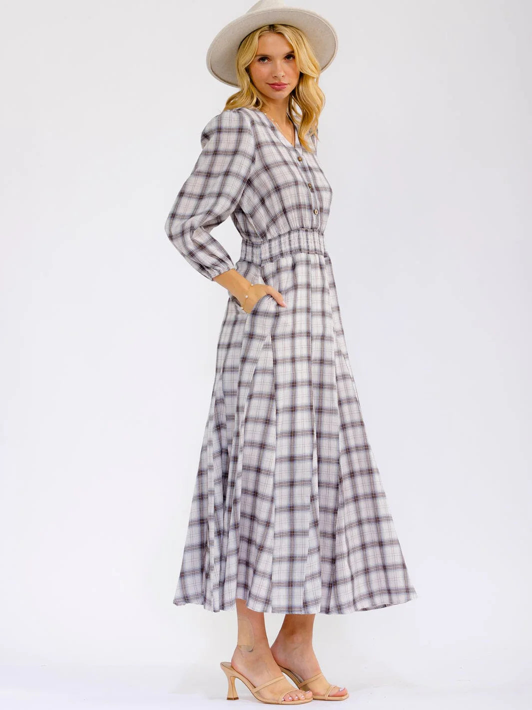 Long sleeve V-neck button-front maxi dress with elastic waist from ModestAndDevoted, featuring a flowing silhouette and casual elegance.