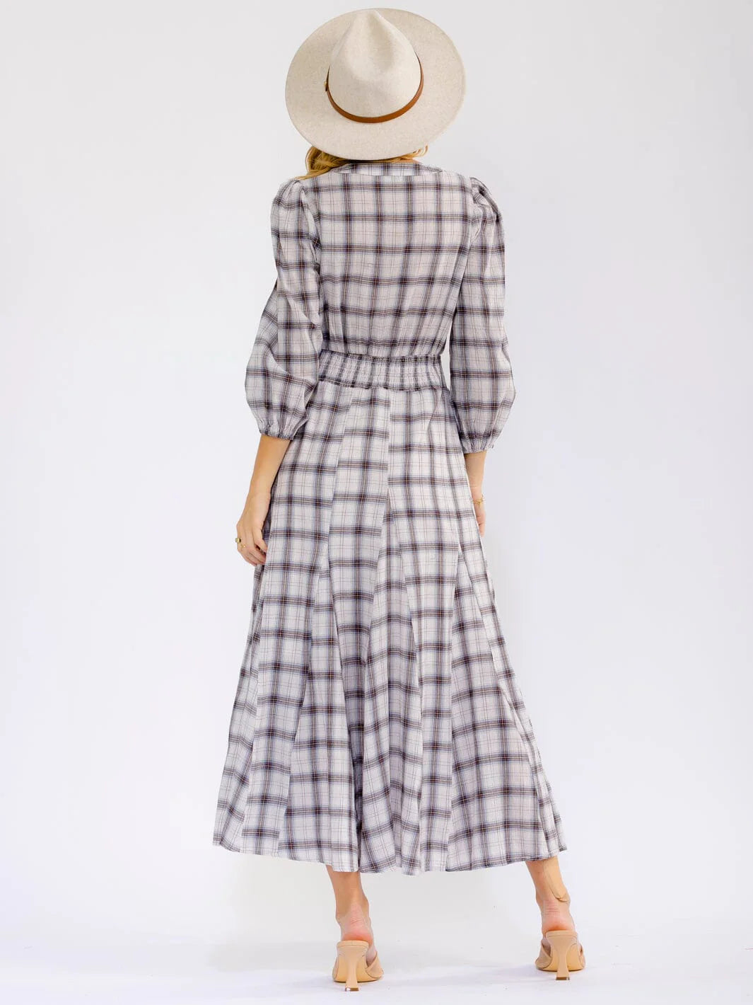 Long sleeve V-neck button-front elastic waist maxi dress by ModestAndDevoted, featuring a flowing silhouette and elegant design.