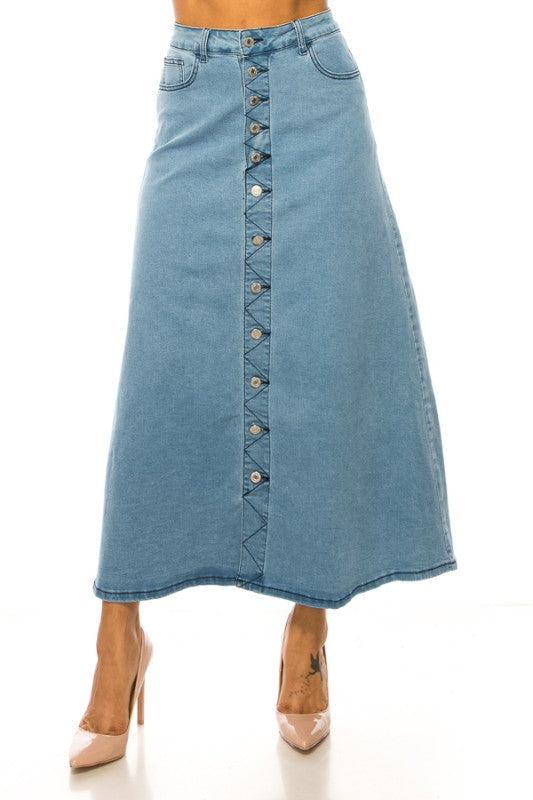 Light wash denim maxi skirt with button front from ModestAndDevoted's Be-Girl collection, featuring a stylish, flowy design.
