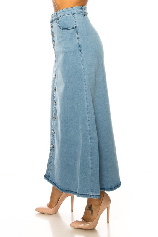 Light wash denim maxi skirt with button front from the Be-Girl collection by ModestAndDevoted, styled with a relaxed fit.