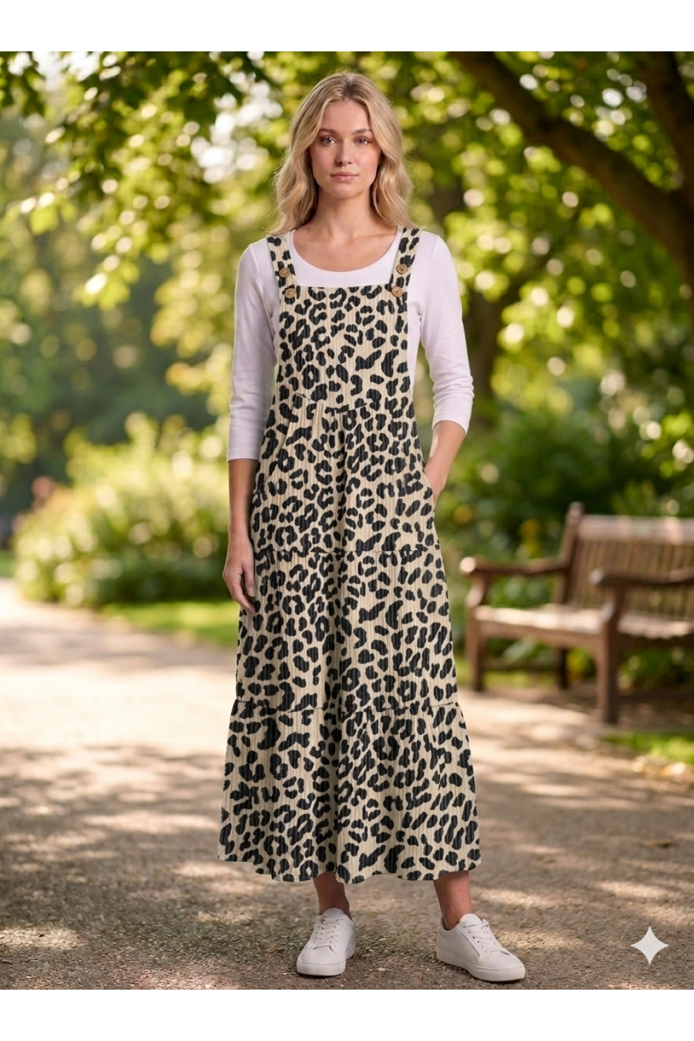 Women's animal print overall maxi dress by ModestAndDevoted featuring a flowy silhouette and bold animal pattern.