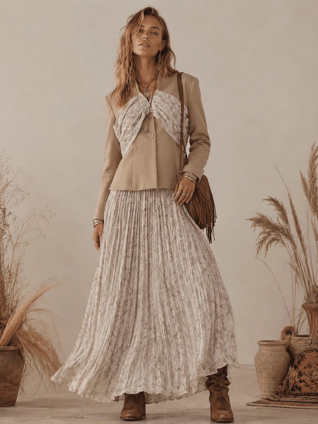 Women's floral pleated 2-piece set with long sleeve blazer and elastic waist maxi skirt by ModestAndDevoted, shown on a model.