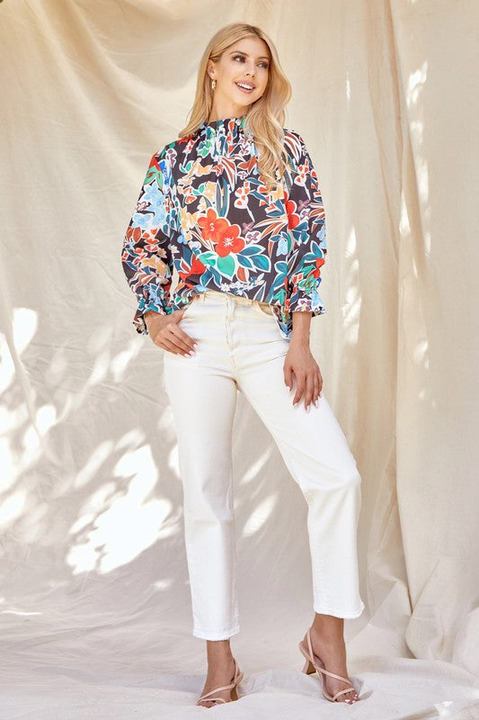 Floral ruffle neck blouse from ModestAndDevoted, stylish shirt with feminine ruffle detailing and floral pattern.