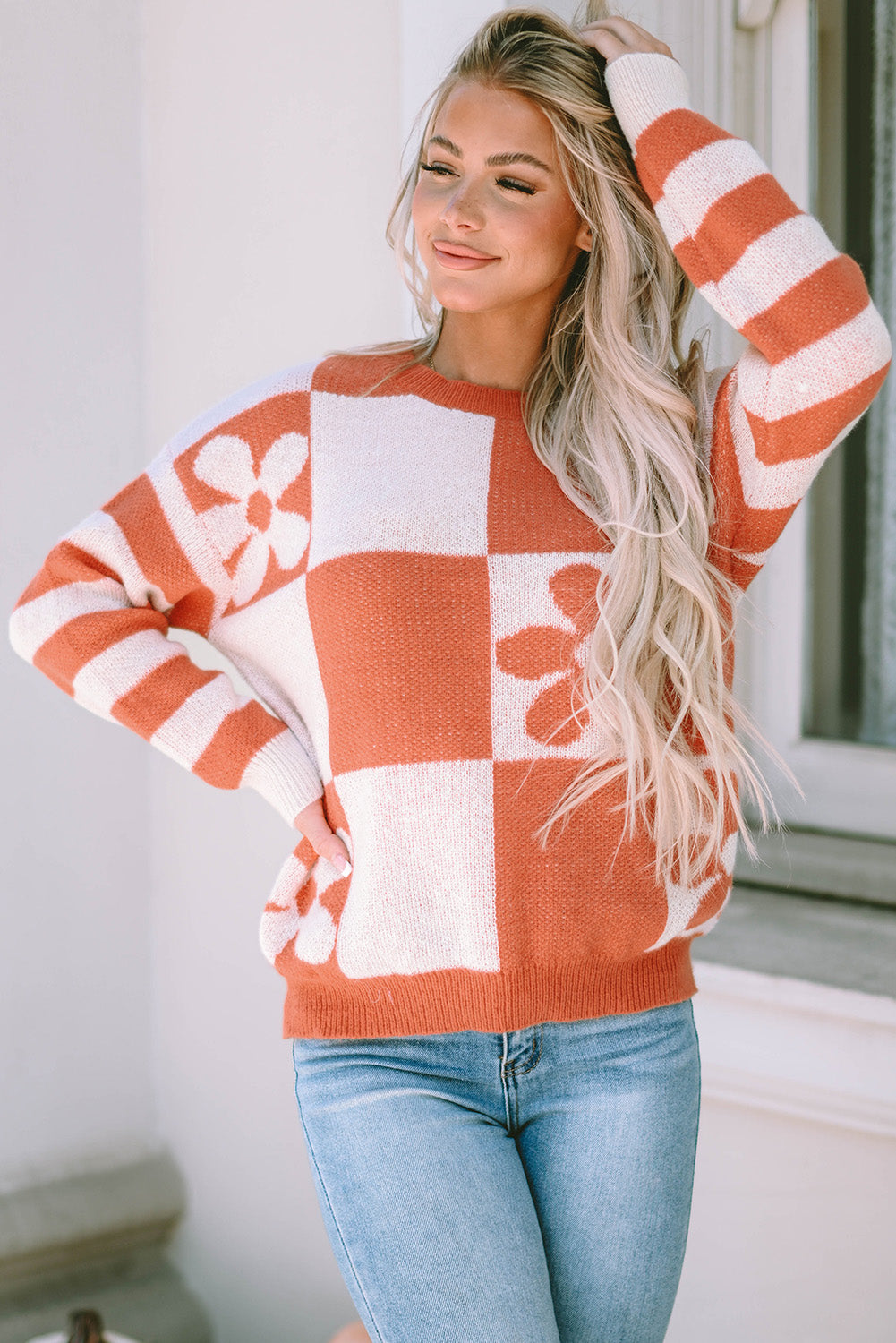 Brown checkered floral print sweater with striped sleeves from ModestAndDevoted, featuring a cozy polyester knit design.