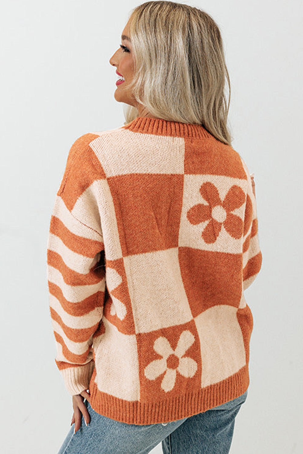 Brown checkered floral print sweater with striped sleeves by ModestAndDevoted, featuring a cozy polyester knit design.