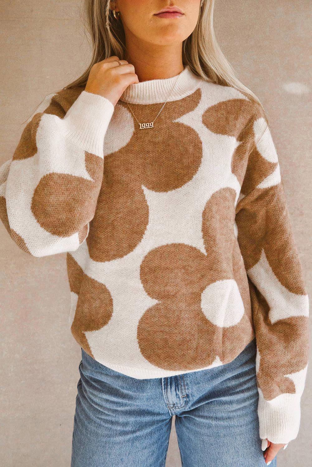 Khaki drop shoulder sweater with large flower pattern from ModestAndDevoted, made of viscose, polyester, and polyamide.