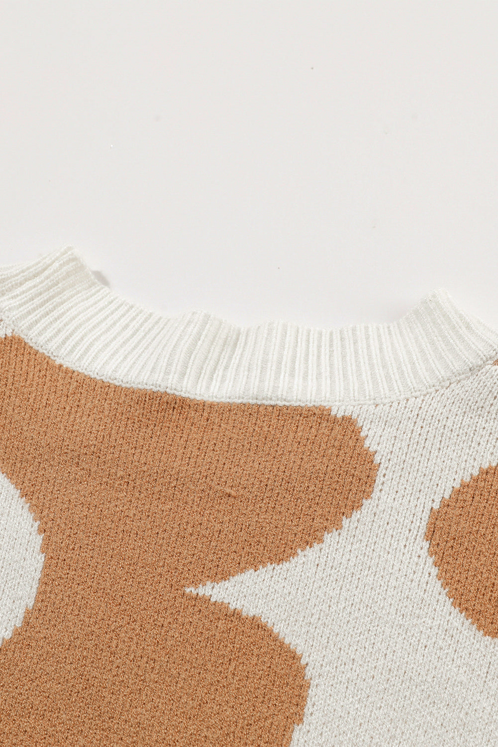 Khaki drop shoulder sweater with large floral pattern from ModestAndDevoted, made of viscose, polyester, and polyamide.