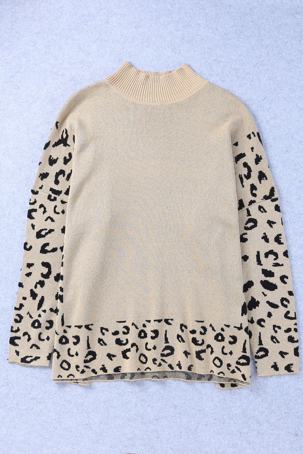 Khaki leopard print oversized sweater by ModestAndDevoted featuring a high neck, side slit, and cozy acrylic-cotton blend.