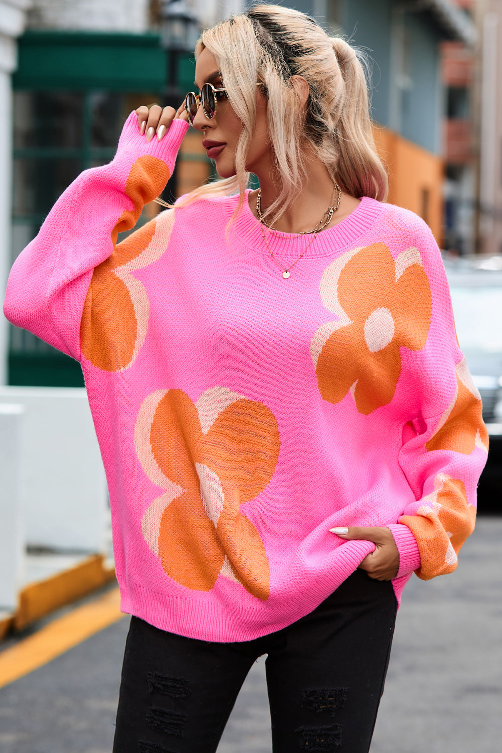 Red flower pattern slouchy sweater from ModestAndDevoted, cozy acrylic knit with relaxed fit and floral design.