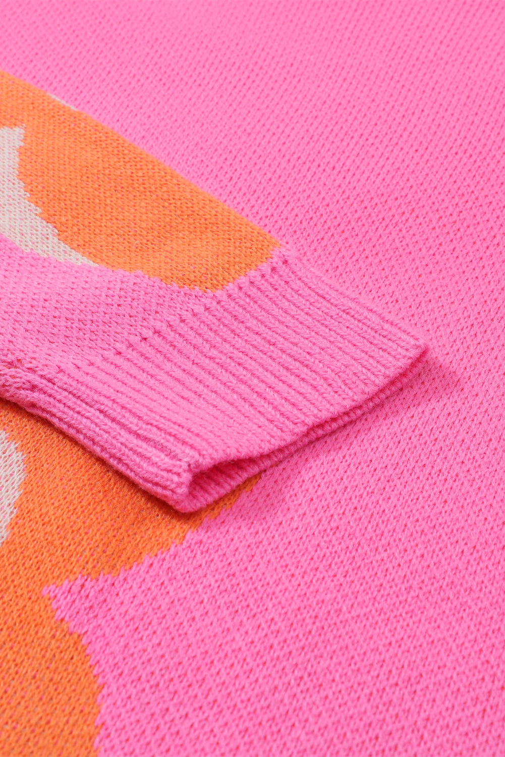 Red flower pattern slouchy sweater from ModestAndDevoted, made of soft acrylic fabric, featuring a cozy, relaxed fit.