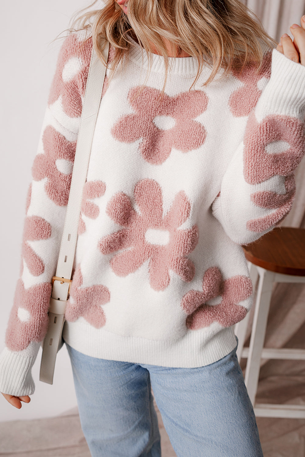 White textured flower drop shoulder loose sweater from ModestAndDevoted, featuring a cozy, relaxed fit and floral design.