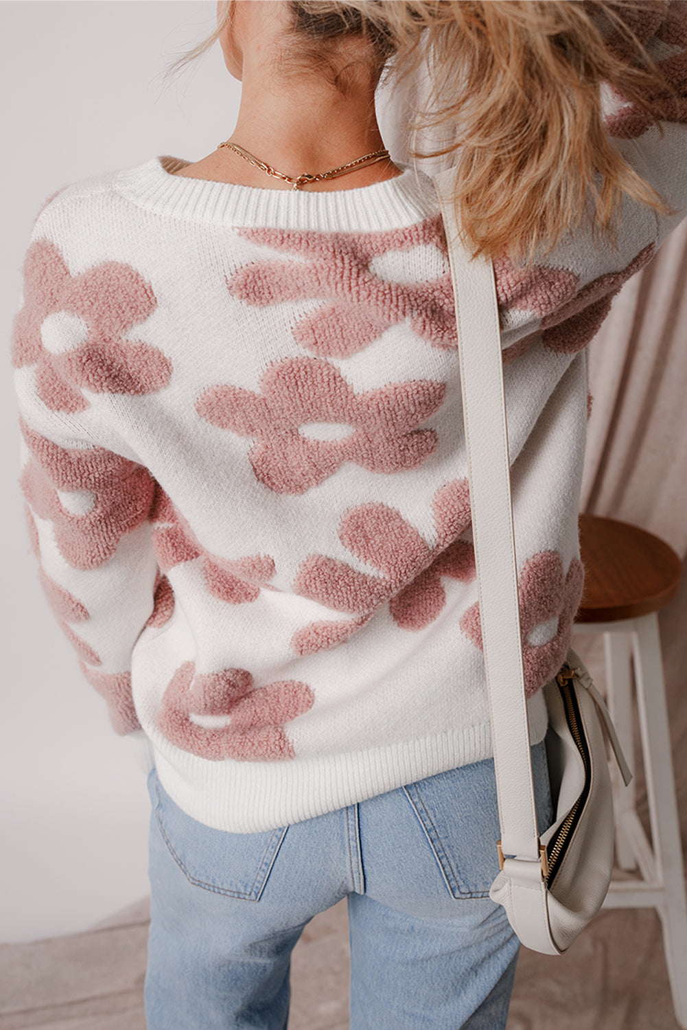 White textured flower drop shoulder loose sweater by ModestAndDevoted, featuring a cozy, relaxed fit and floral design.