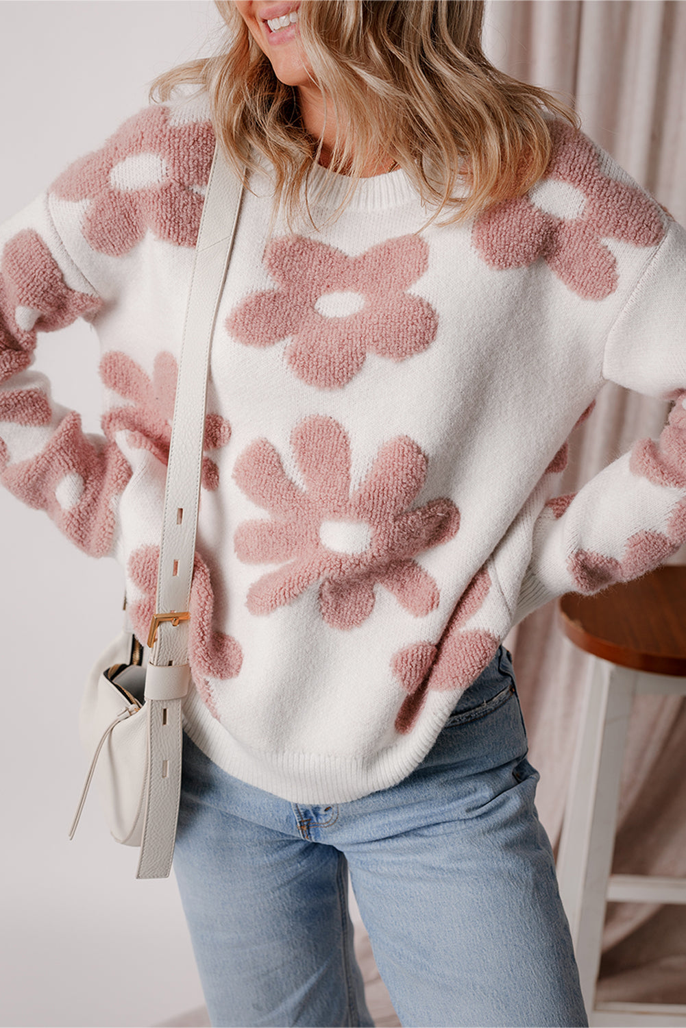 White textured flower drop shoulder loose sweater by ModestAndDevoted, featuring a relaxed fit and floral pattern.