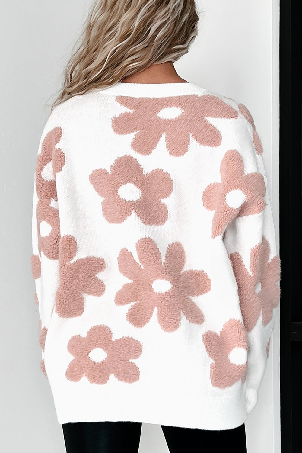 White textured flower drop shoulder loose sweater from ModestAndDevoted, featuring a cozy, relaxed fit and floral design.