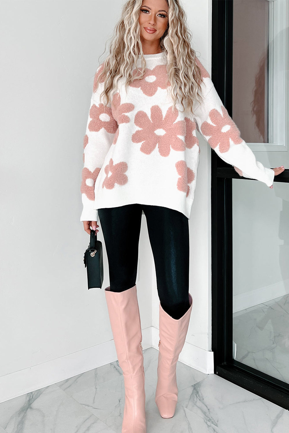 White textured flower drop shoulder loose sweater from ModestAndDevoted, featuring a relaxed fit and floral knit design.