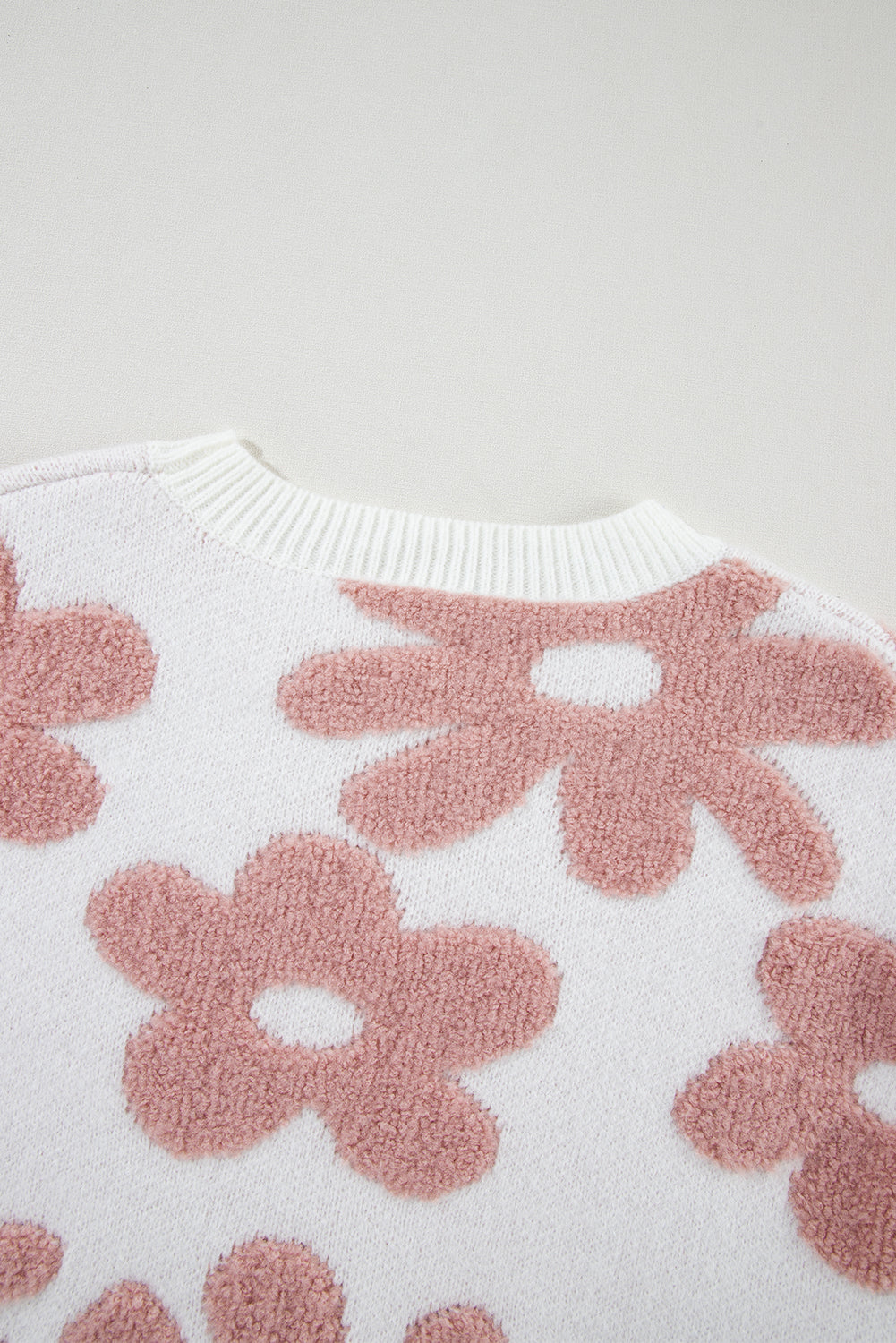 White textured flower drop shoulder sweater by ModestAndDevoted, loose fit with soft acrylic, polyester, and polyamide fibers.