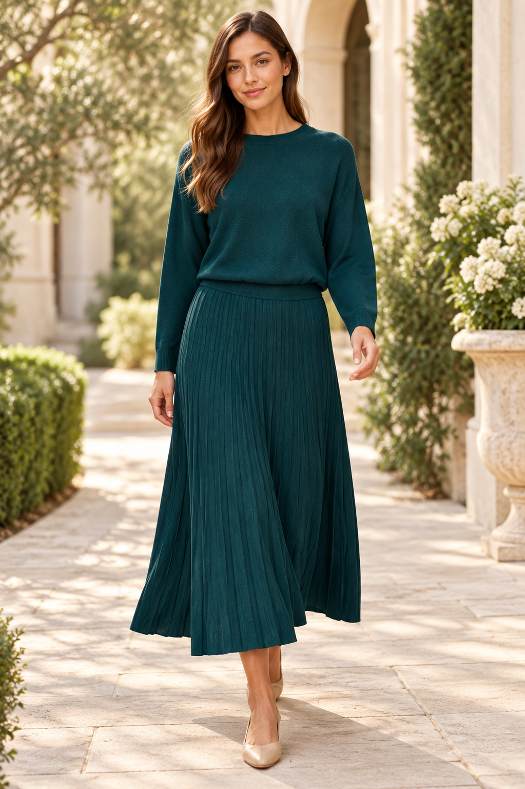 Forest teal high-waisted pleated midi skirt from ModestAndDevoted, shown with a boat neck dolman sleeve ribbed sweater.