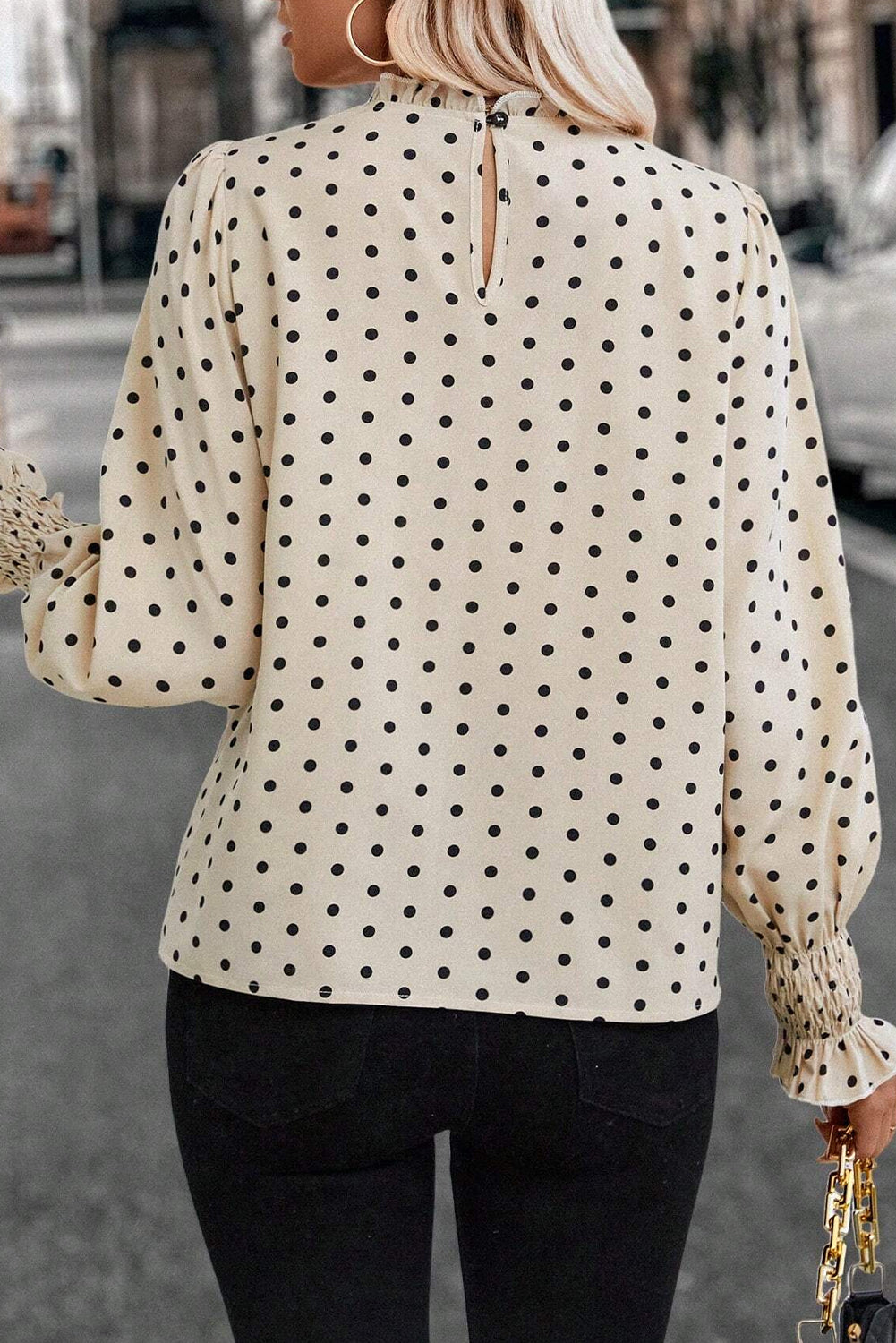 Apricot polka dot print blouse with frilled collar and lantern sleeves from ModestAndDevoted, made of lightweight polyester fabric.