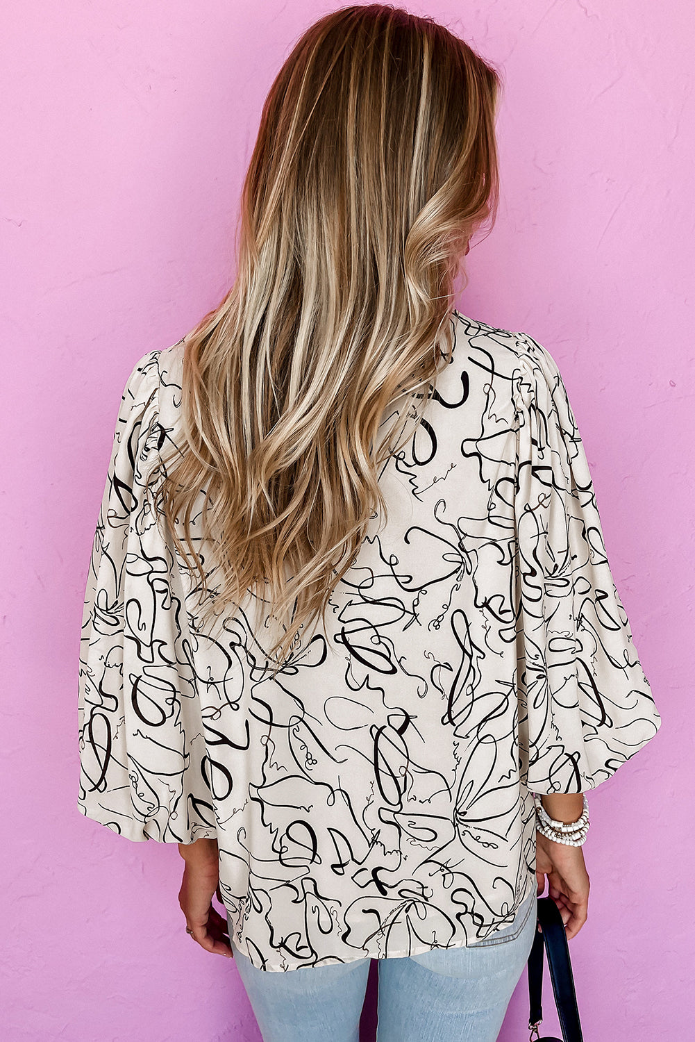 Beige abstract print balloon sleeve crew neck blouse by ModestAndDevoted, featuring 100% polyester fabric and stylish design.