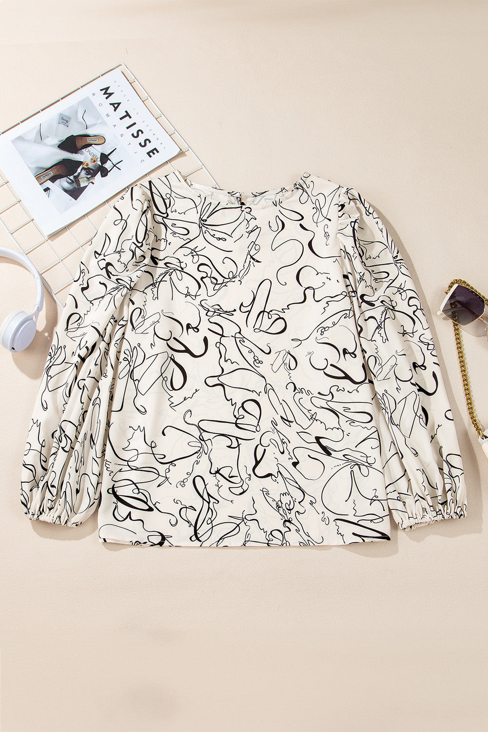 Beige abstract print balloon sleeve crew neck blouse by ModestAndDevoted, made of lightweight polyester fabric.