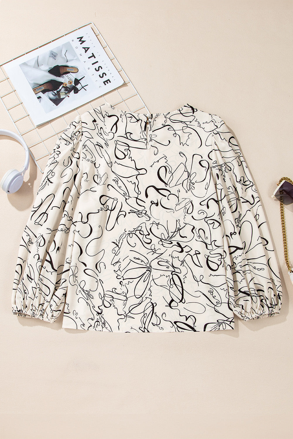 Beige abstract print balloon sleeve crew neck blouse by ModestAndDevoted, made from lightweight polyester fabric.