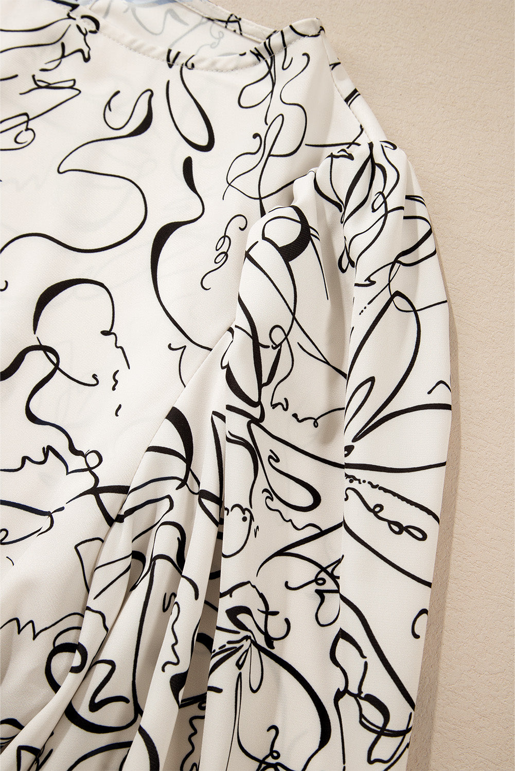 Beige abstract print balloon sleeve crew neck blouse from ModestAndDevoted, made of polyester with stylish design.