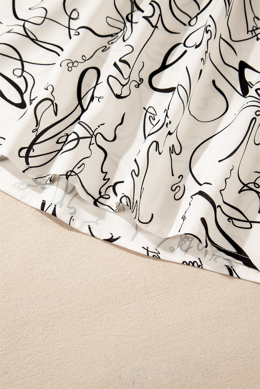 Beige abstract print balloon sleeve crew neck blouse by ModestAndDevoted, featuring 100% polyester fabric and stylish design.