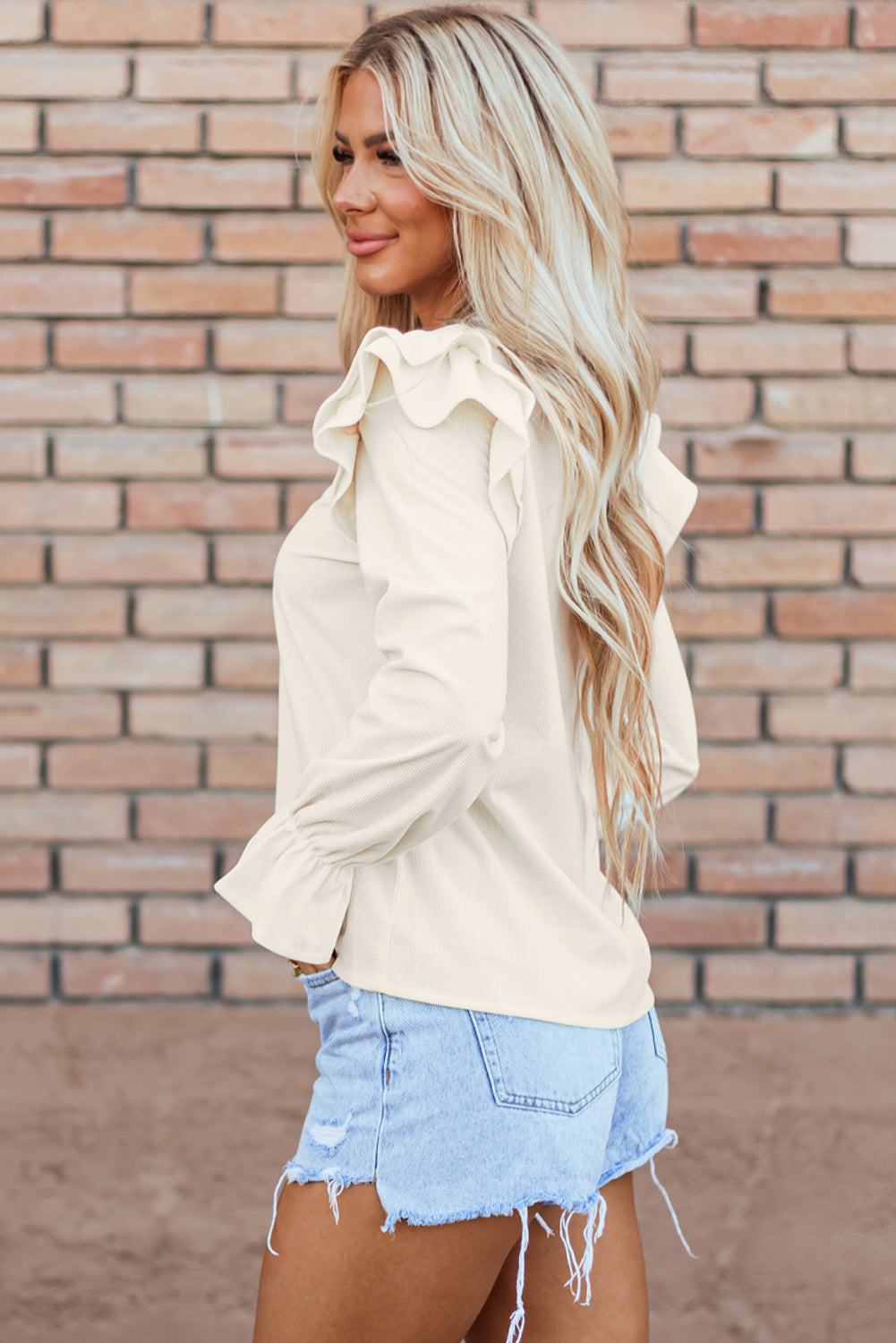 Beige corduroy blouse with ruffled flounce sleeves from ModestAndDevoted, featuring a stylish, casual top for women.