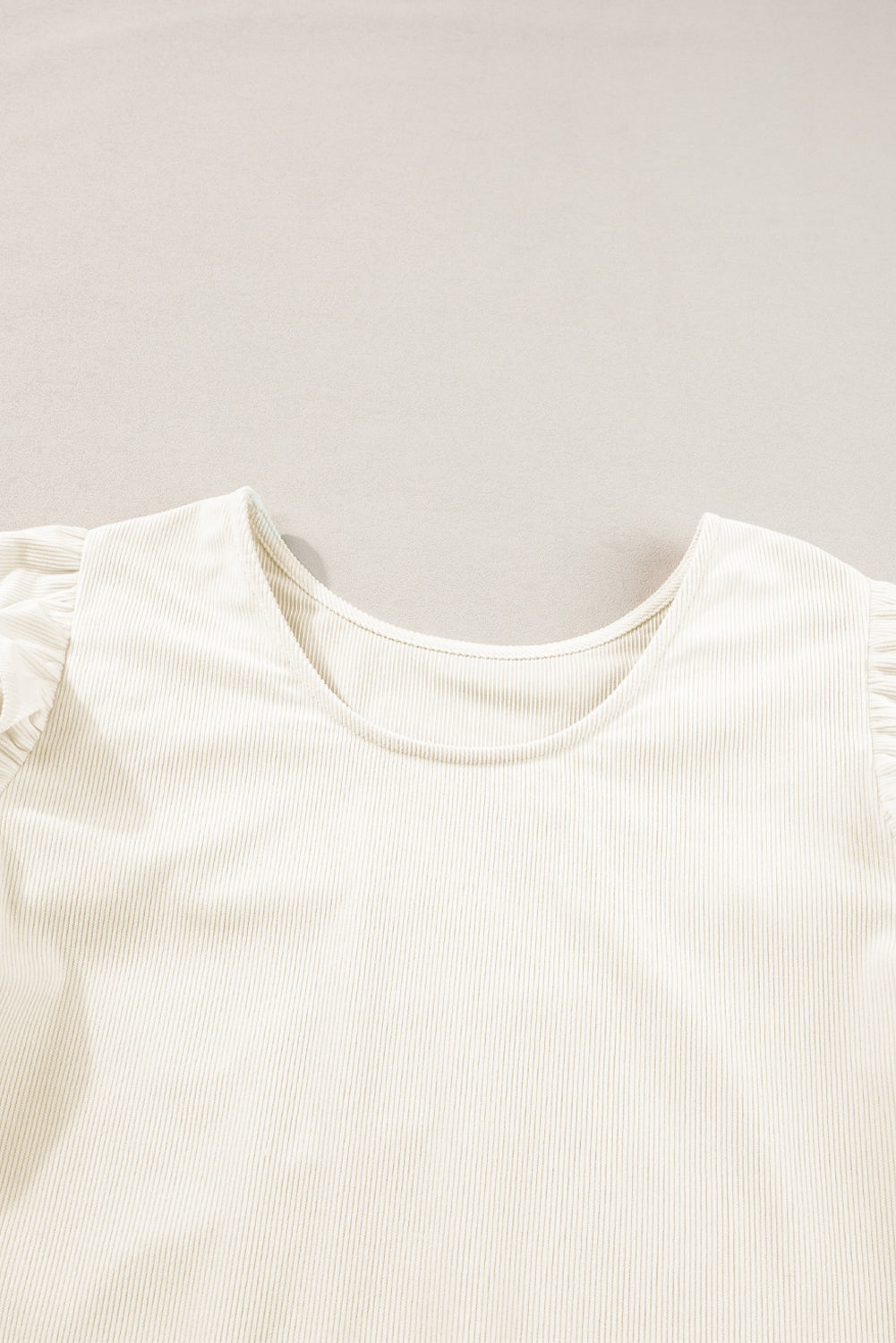 Beige corduroy blouse with ruffled flounce sleeves from ModestAndDevoted, stylish top perfect for casual or dressy occasions.