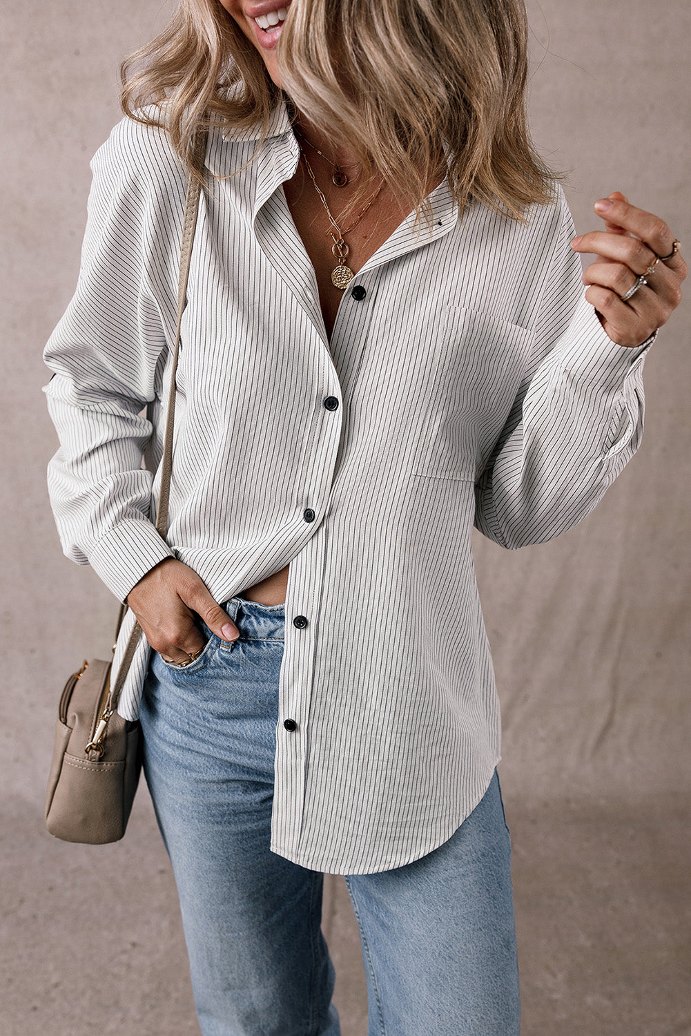Black striped long shirt with roll-tab sleeves and front pockets from ModestAndDevoted, made of polyester and cotton blend.