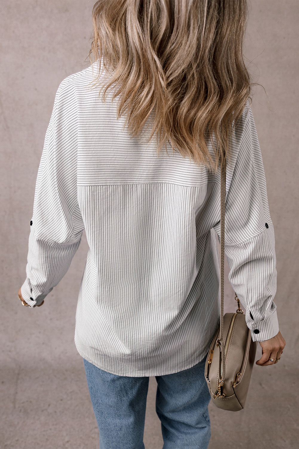 Black stripe long shirt with roll-tab sleeves and chest pockets, by ModestAndDevoted, made of polyester and cotton blend.