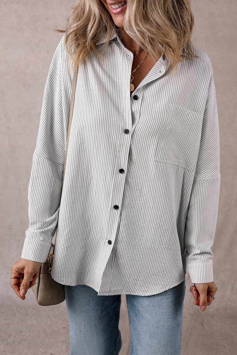 Black stripe long shirt with roll-tab sleeves and front pockets by ModestAndDevoted, made of polyester and cotton for a casual, stylish look.
