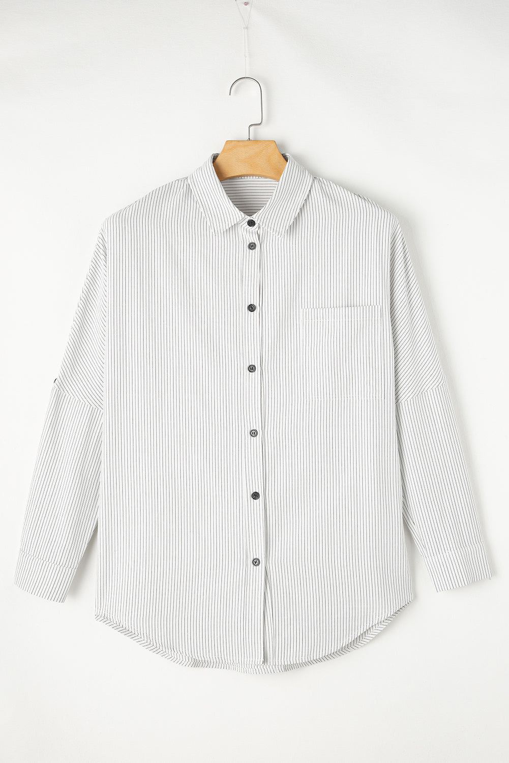 Black stripe long shirt with roll-tab sleeves and chest pockets, by ModestAndDevoted, made of polyester and cotton blend.