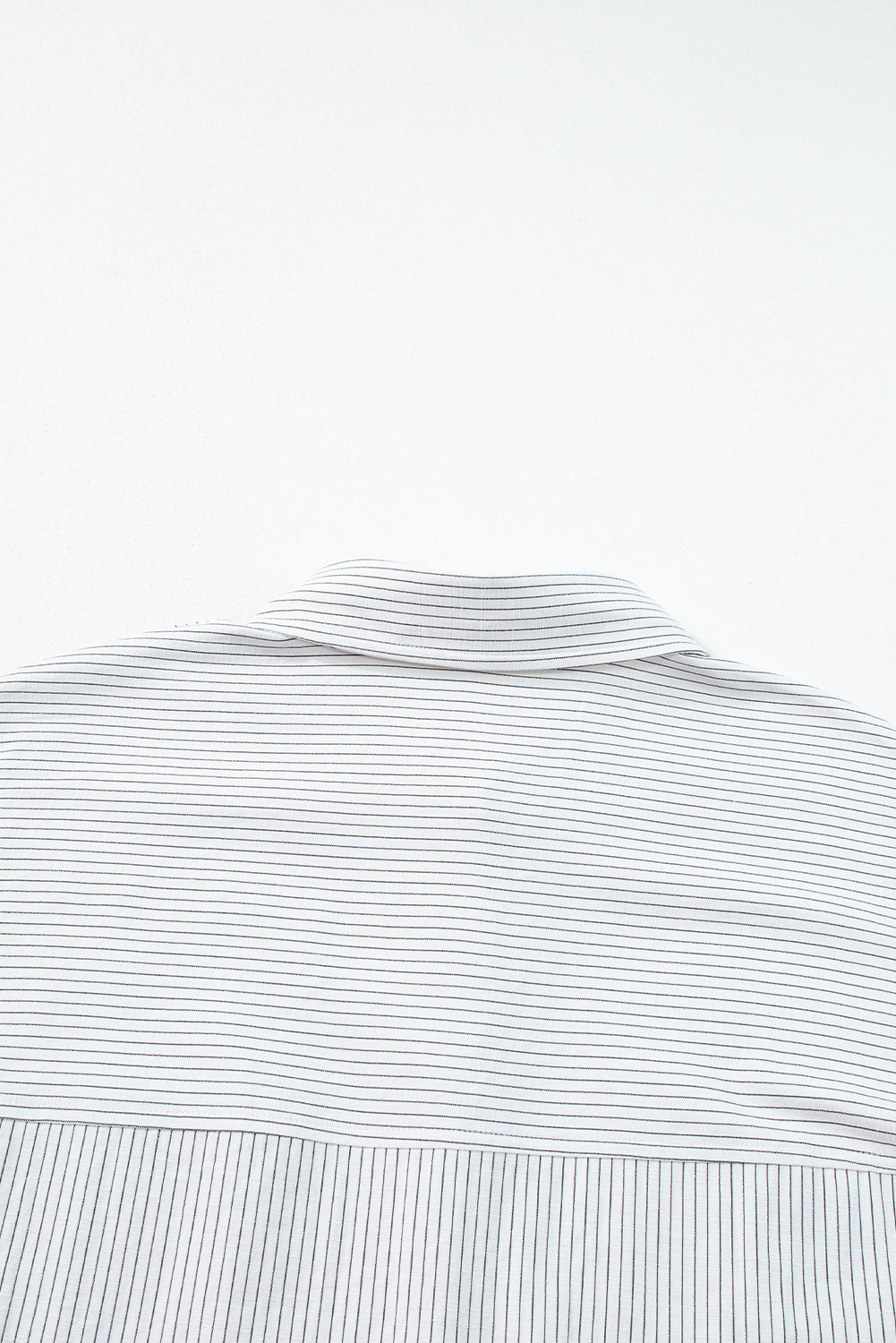 Black stripe long shirt with roll-tab sleeves and front pockets, by ModestAndDevoted, made of polyester and cotton.