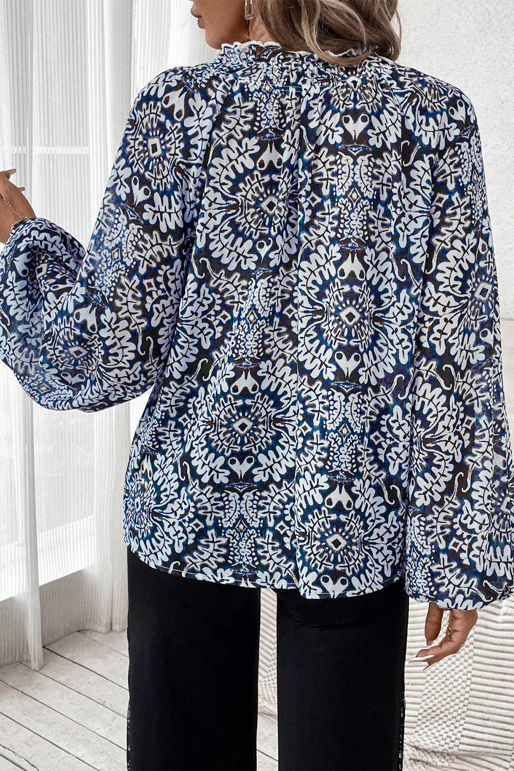 Blue tribal print lace-up blouse with frilled neck and puff sleeves, from ModestAndDevoted, made of polyester.