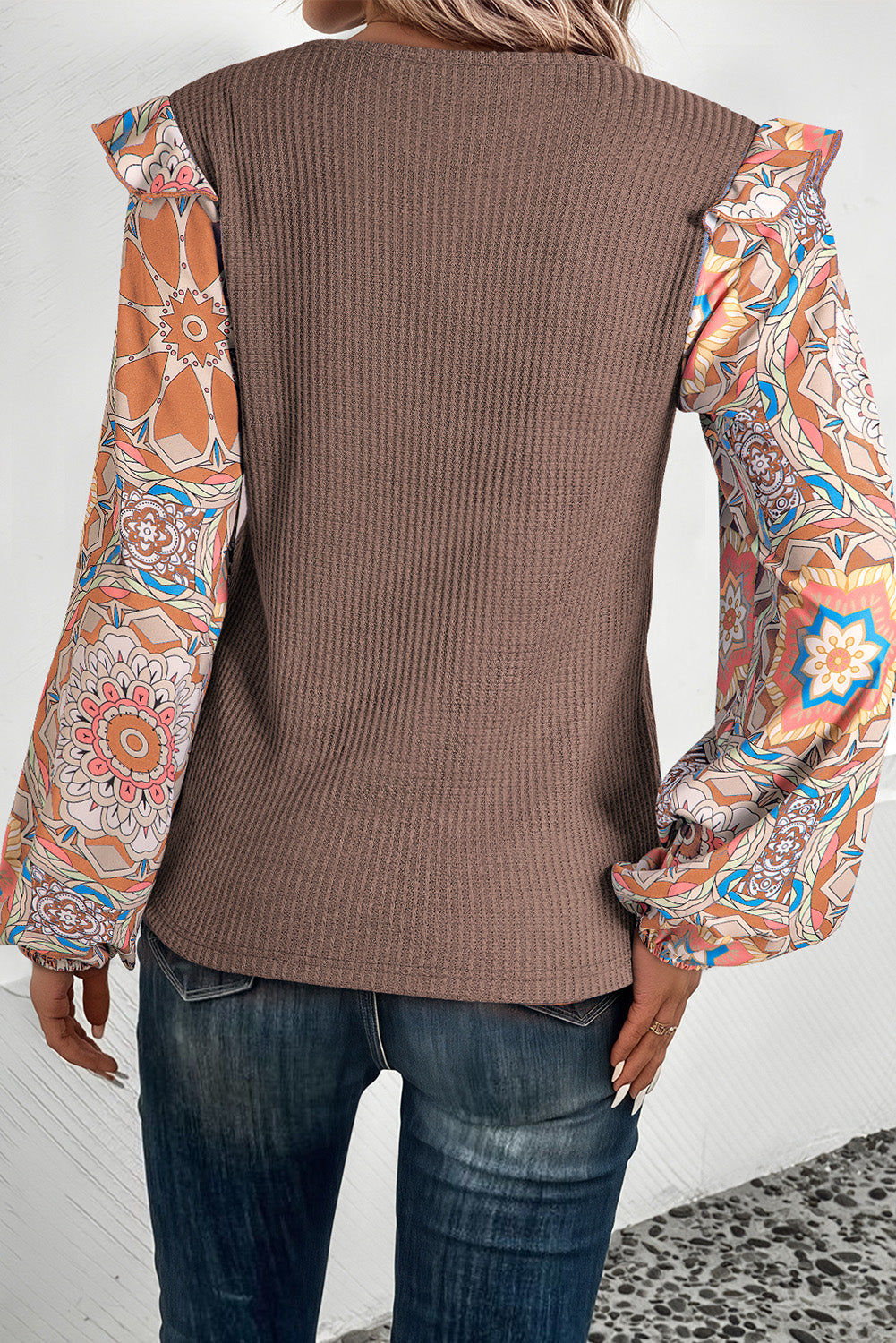 ModestAndDevoted coffee-colored waffle knit blouse with ruffled floral sleeves and patchwork design, featuring an O-neck style.