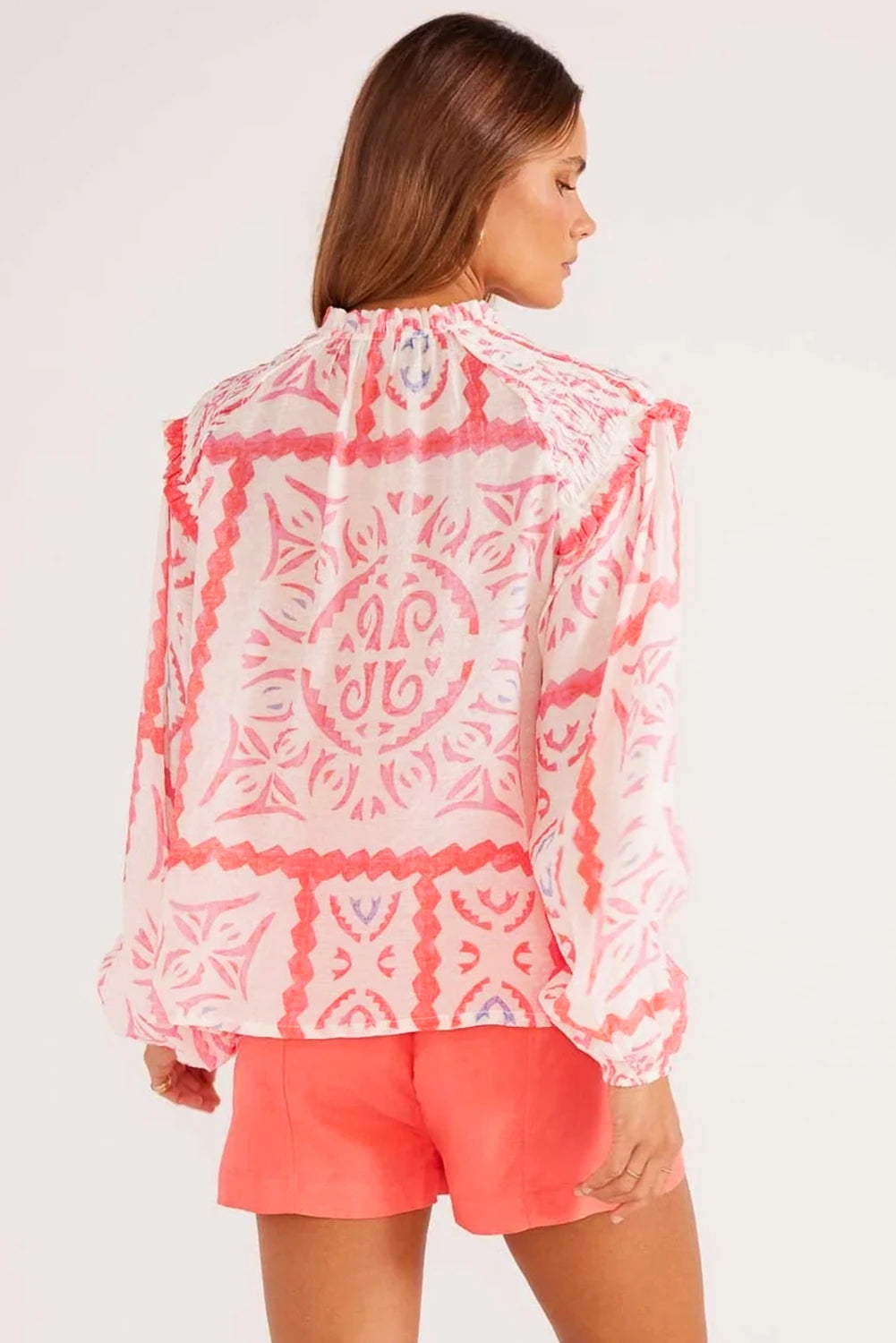 Desert Flower vintage print blouse by ModestAndDevoted featuring smocked poet collar and billowy blouson sleeves, made of polyester.