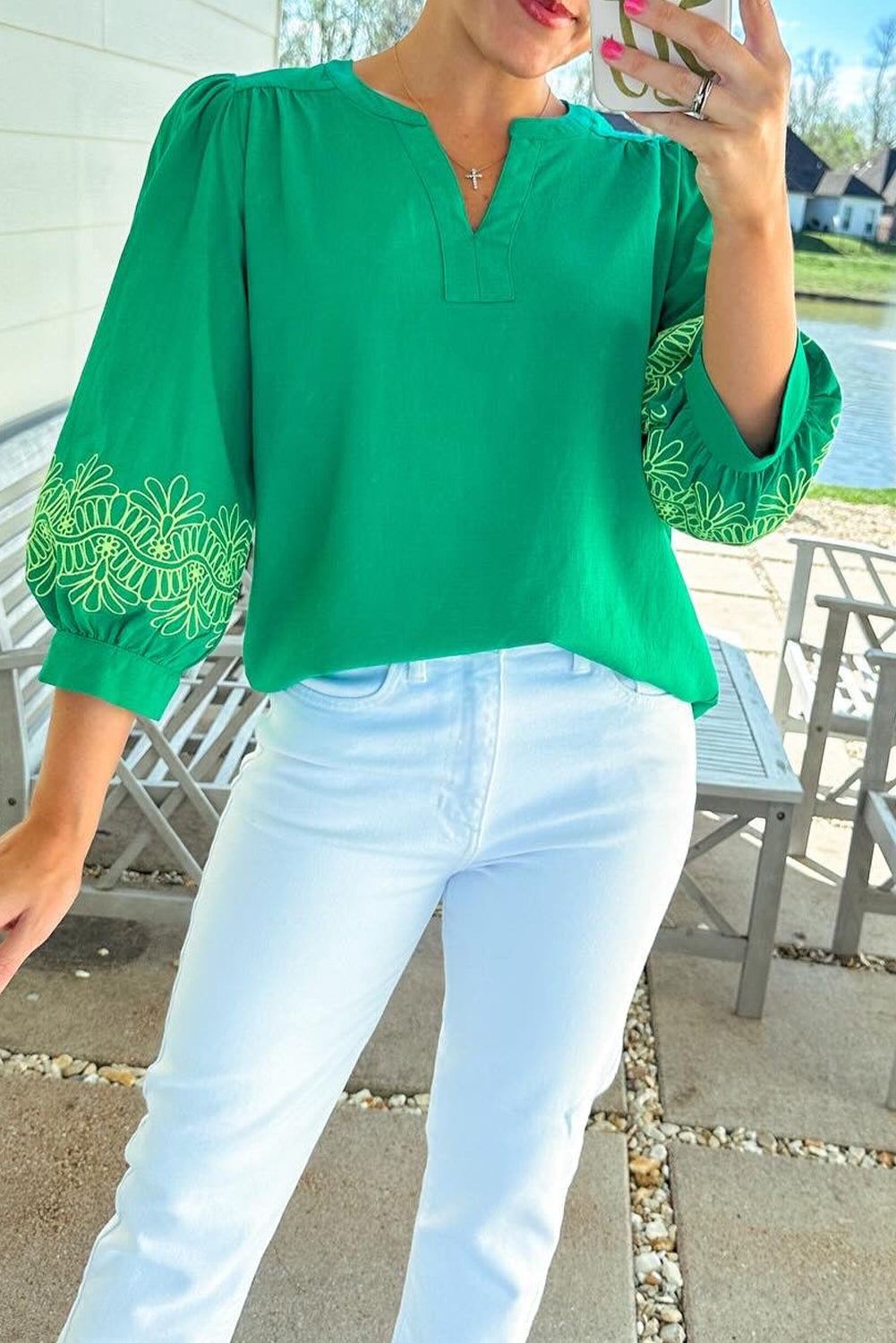 Green floral embroidered blouse from ModestAndDevoted featuring 3/4 sleeves, notched V-neck, and elegant contrast details.