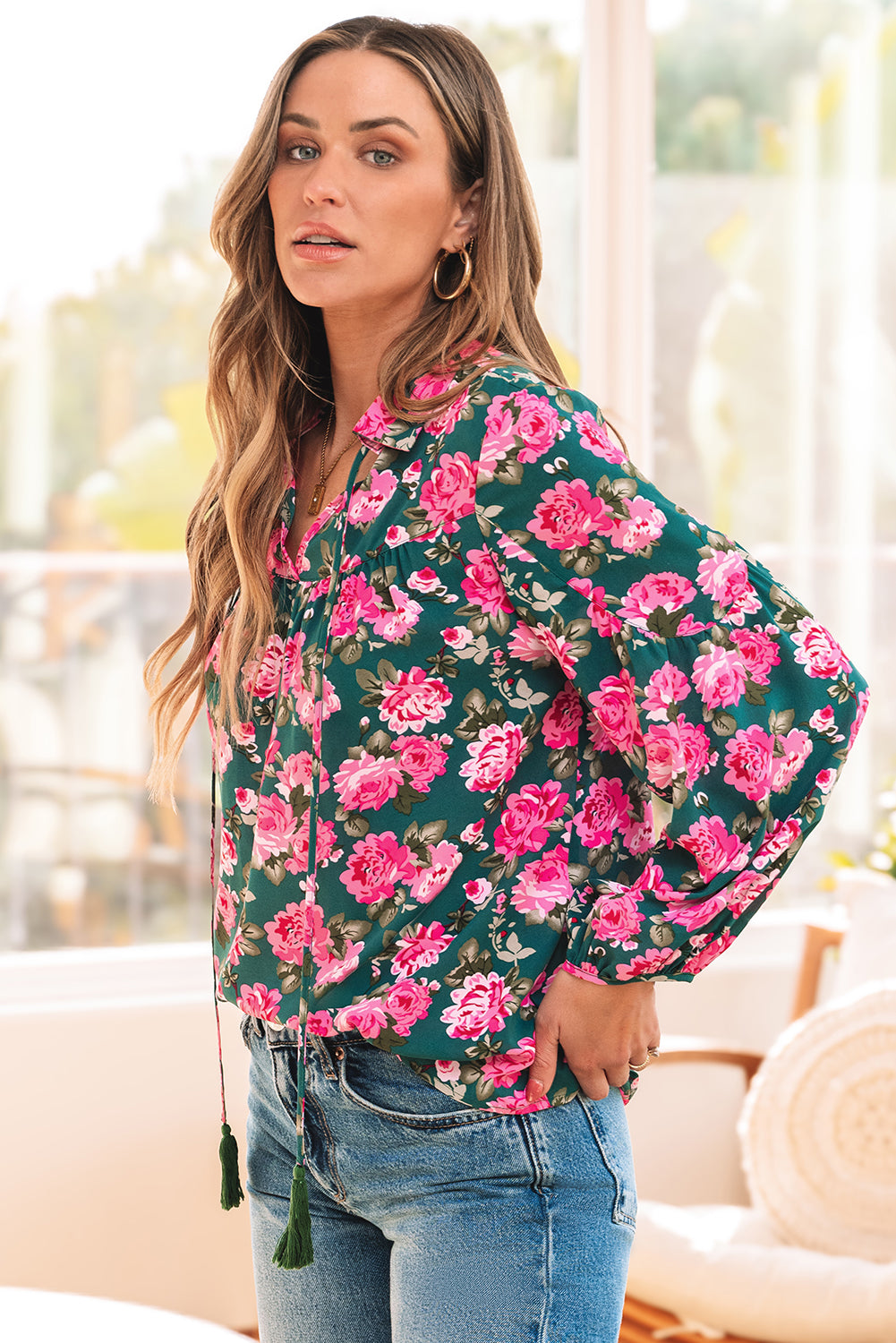 Green floral printed blouse with tied collar and puff sleeves by ModestAndDevoted, made of 100% polyester.