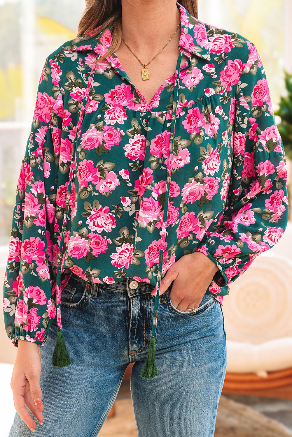 Green floral printed blouse with tied collar and puff sleeves, by ModestAndDevoted, made of lightweight polyester.