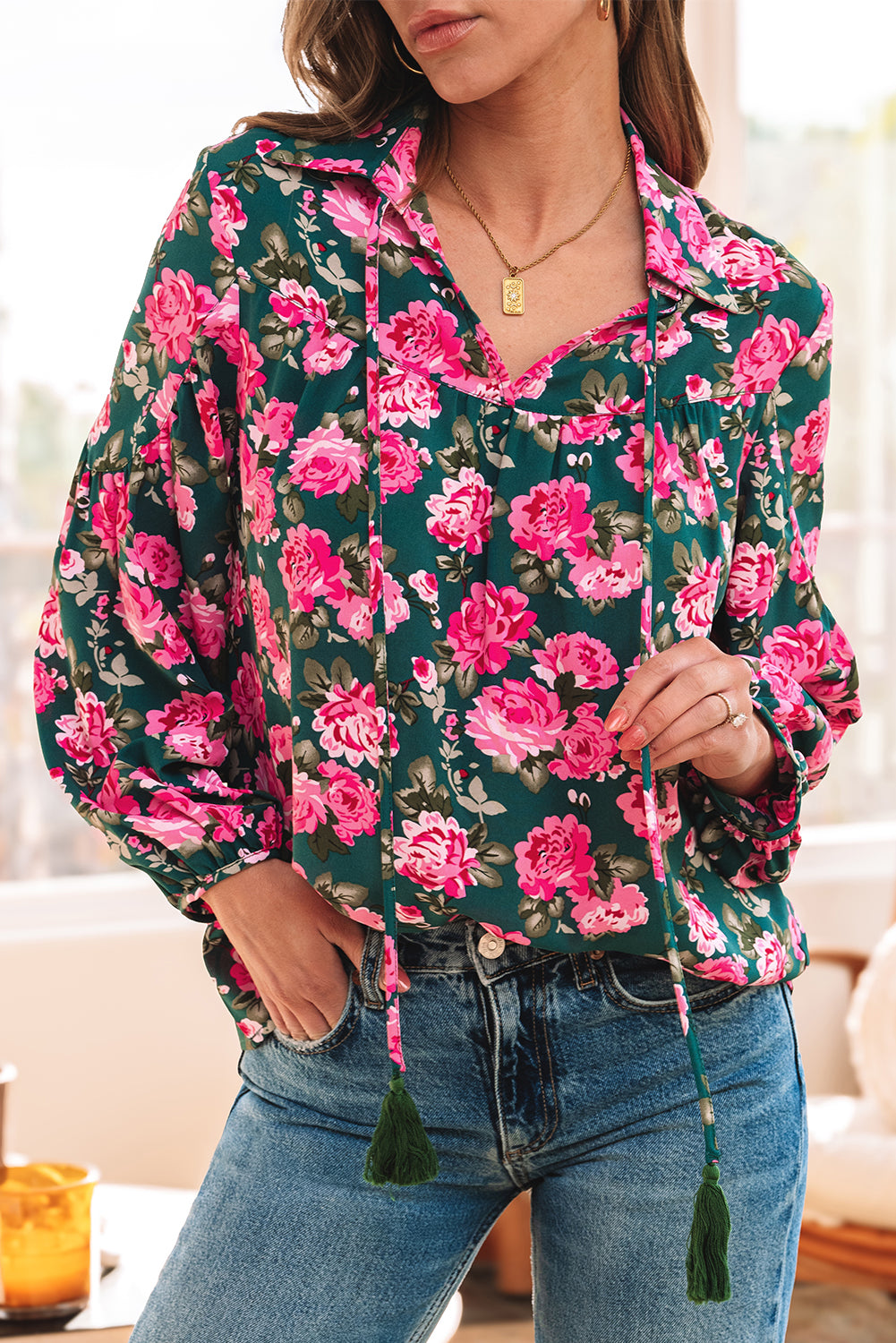 Green floral printed blouse with tied collar and puff sleeves from ModestAndDevoted, made of lightweight polyester fabric.