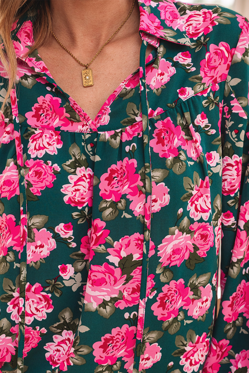 Green floral printed blouse with tied collar and puff sleeves from ModestAndDevoted, made of 100% polyester, stylish and comfortable top.