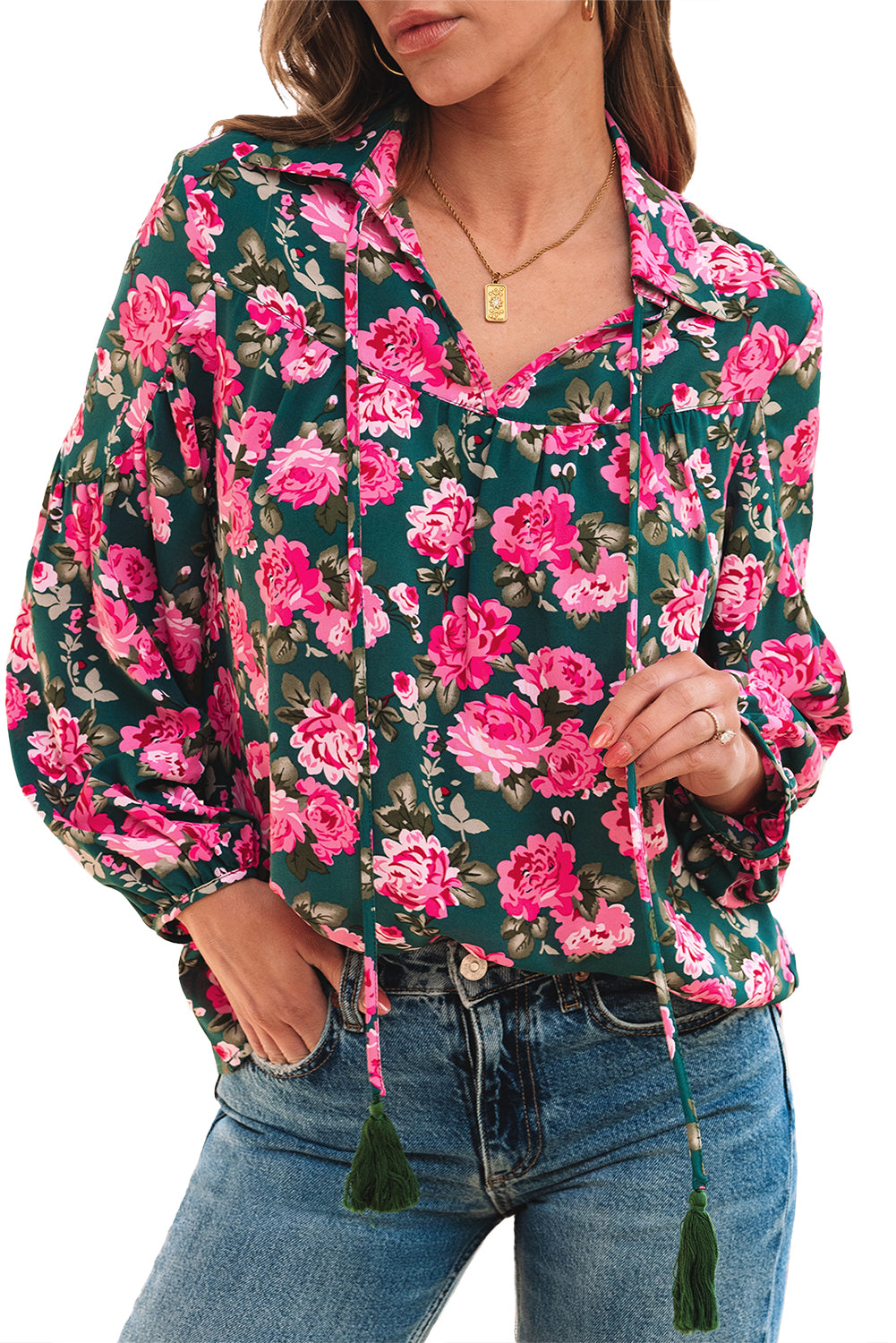 Green floral printed blouse with tied collar and puff sleeves from ModestAndDevoted, made of lightweight polyester fabric.