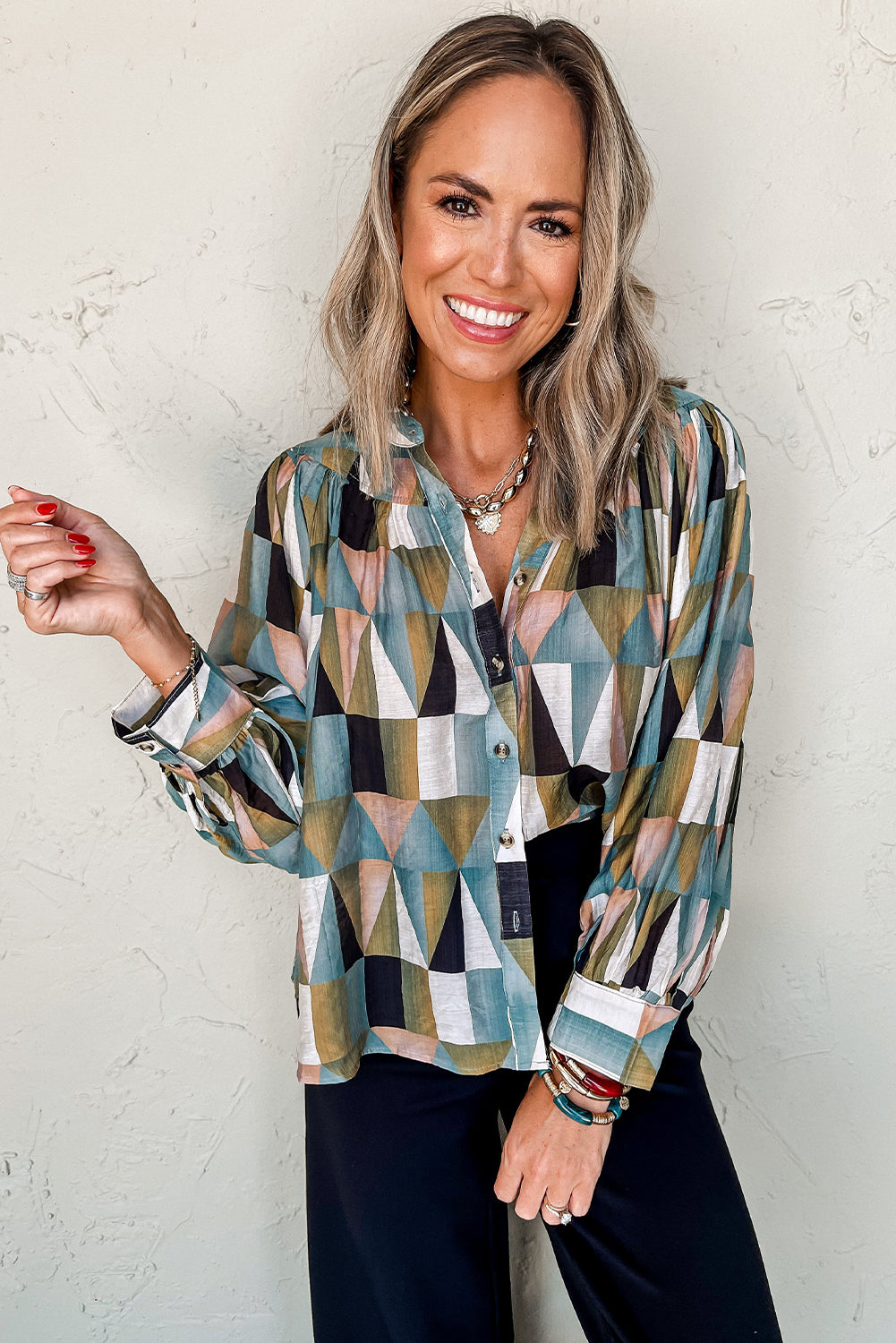 Green geometric print loose fit blouse with buttoned balloon sleeves by ModestAndDevoted, made from viscose and polyamide fabric.