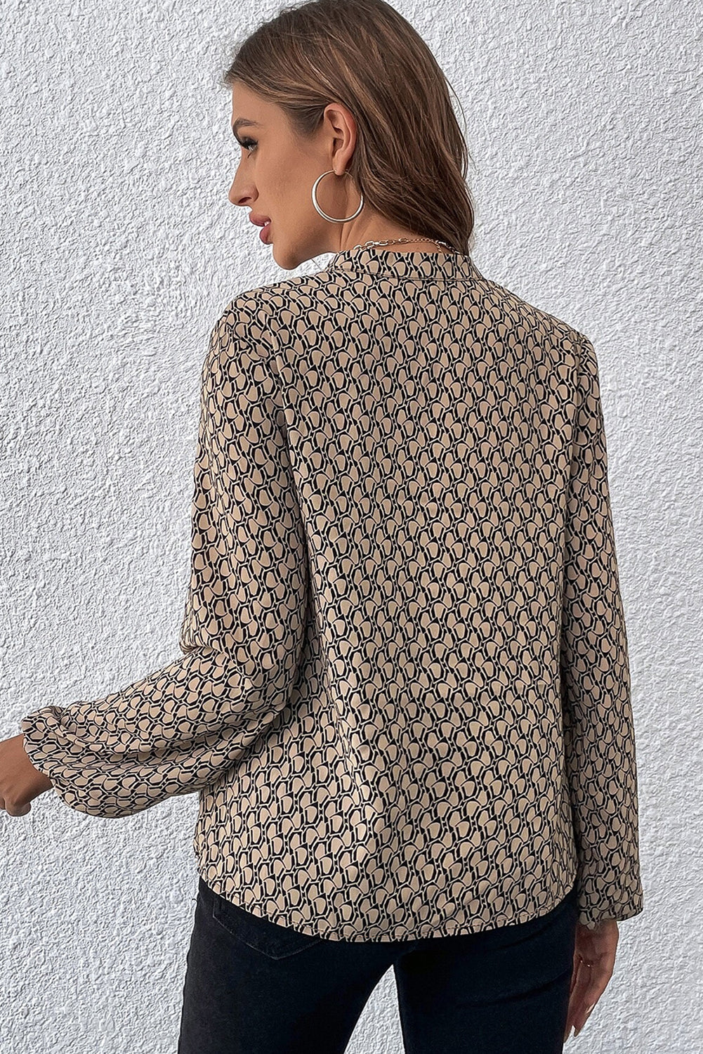 Khaki geometric print puff sleeve blouse with notched neck from ModestAndDevoted, made of polyester, styled with a relaxed fit.